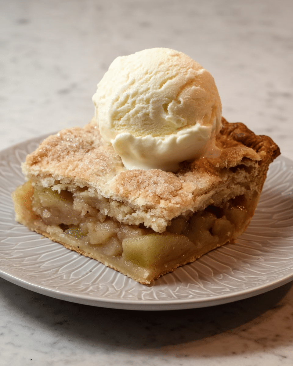 A piece of thick, square pie with two layers of crust, one on the bottom and one on the top, both light brown and crumbly with a slightly rough texture, filled with a soft, greenish-brown fruit filling visible from the side. On top of the pie sits a large scoop of creamy, pale yellow vanilla ice cream with a smooth texture. The pie and ice cream are on a white plate with a subtle geometric raised pattern, placed on a white marbled surface. photo taken with an iphone --ar 4:5 --v 7