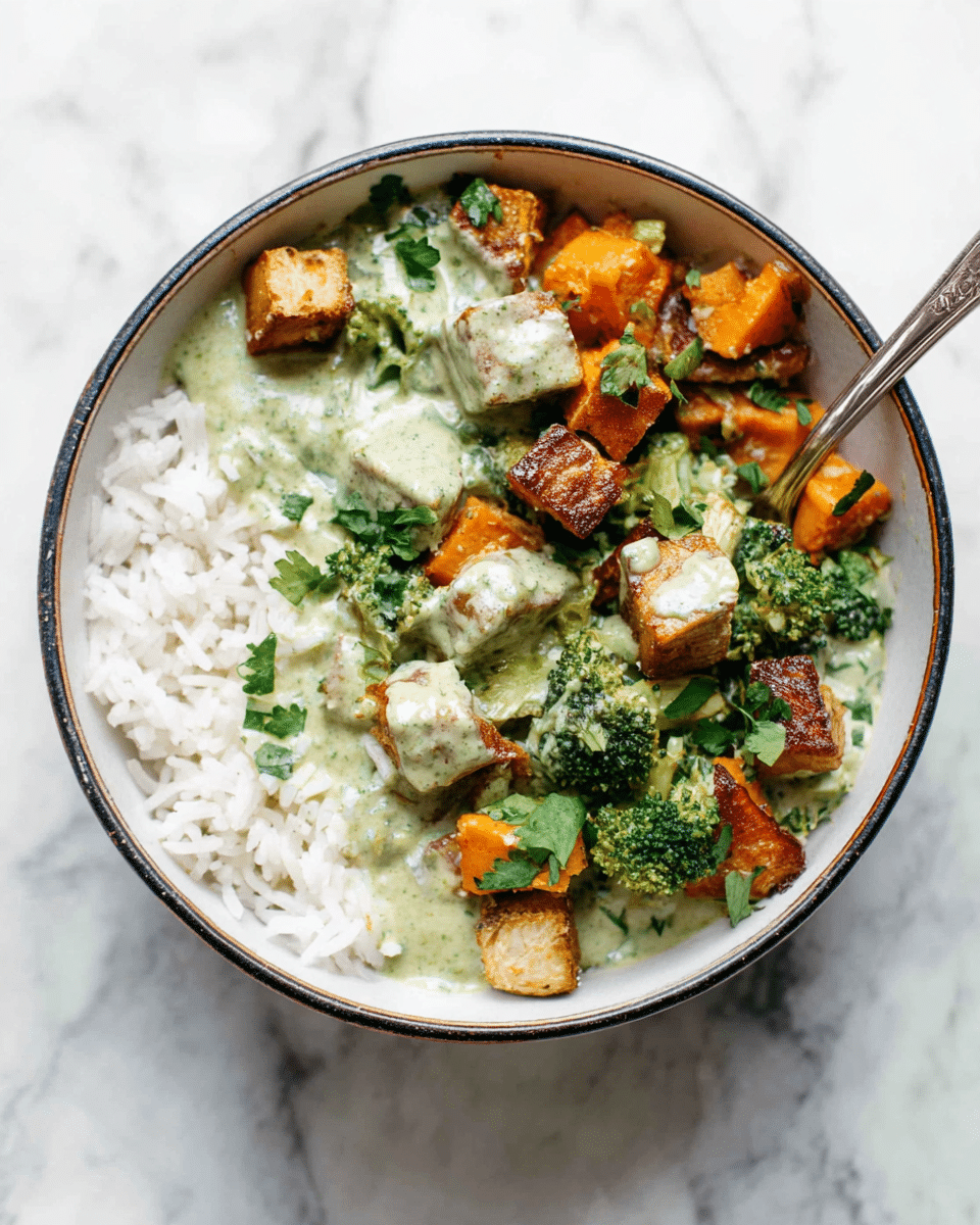 A bowl filled with three layers: the bottom layer is white rice, fluffy and spread evenly on one side, the middle layer consists of a creamy light green sauce covering parts of the rice, and the top layer contains small browned tofu cubes, bright green broccoli florets, and orange sweet potato chunks mixed with chopped green herbs. The bowl is white with a thin dark rim, and two silver forks rest inside the bowl. The bowl sits on a white marbled surface. photo taken with an iphone --ar 4:5 --v 7