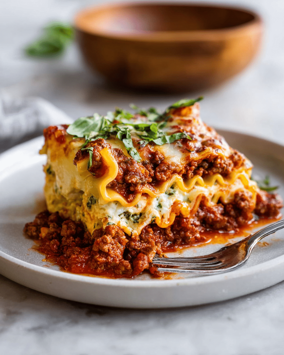 A white baking dish holds a golden lasagna being served with a wooden spatula, lifting one square piece from the layered stack. The lasagna has multiple layers: the bottom layer is a rich red meat sauce with ground beef and tomato bits, followed by sheets of pale yellow pasta. On top of this is a thick layer of melted white mozzarella cheese sprinkled with browned, bubbly spots. Fresh green basil leaves are scattered over the lasagna, adding color contrast. The cheese stretches slightly as the piece is lifted, revealing gooey texture. The scene sits on a white marbled surface with a small wooden bowl of grated cheese nearby. Photo taken with an iphone --ar 4:5 --v 7