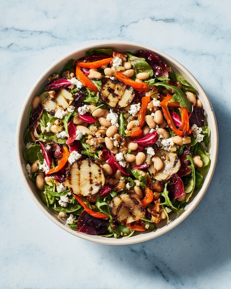 A white bowl filled with a colorful salad sits on a white marbled surface. The salad has many layers including dark green arugula leaves, light beige white beans, and toasted golden-brown slices of grilled leek evenly scattered on top. Bright orange strips of roasted carrots and chunks of red bell pepper add vivid color throughout the mix. There are also small bits of crumbly white cheese and some pieces of deep red radicchio leaves mixed evenly in between. The salad looks fresh with different textures from soft beans to crunchy vegetables. Photo taken with an iphone --ar 4:5 --v 7